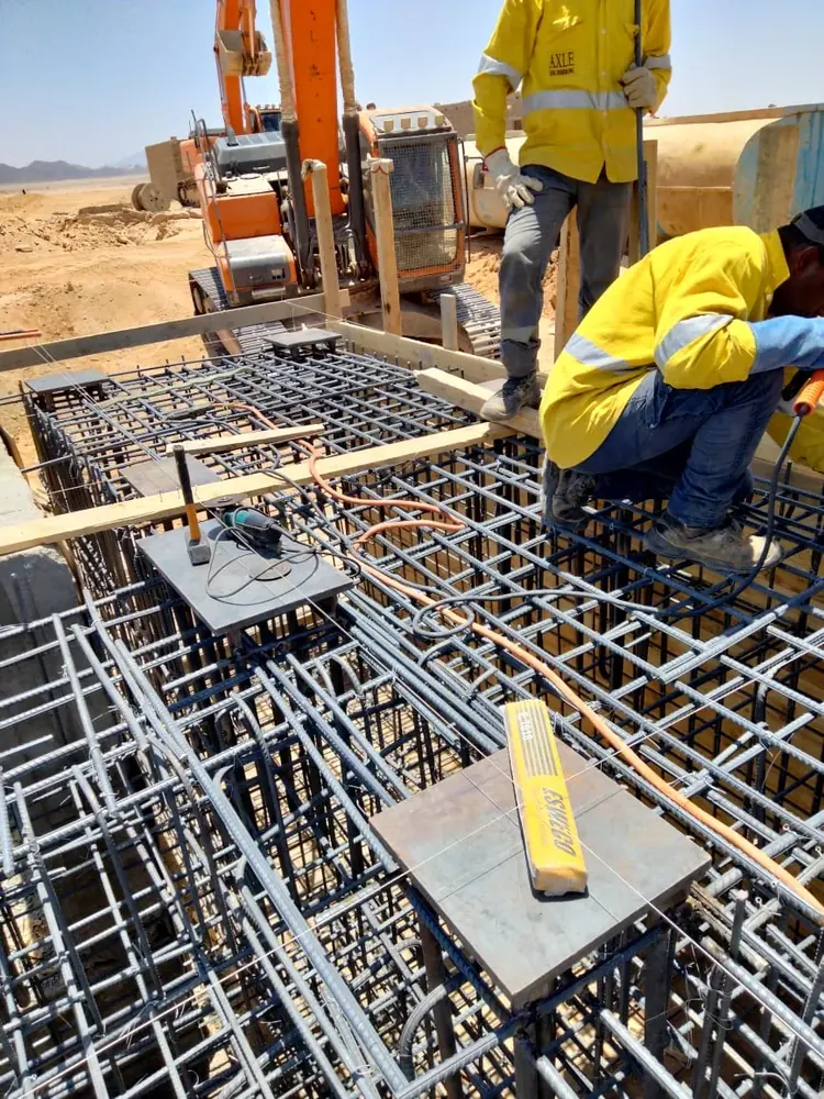 An Axle crew fixing reinforcement on site